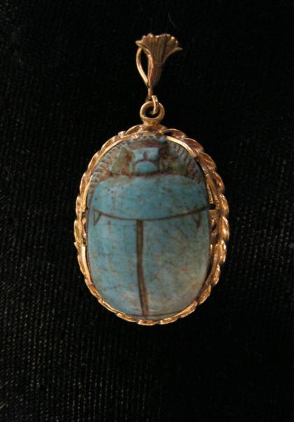 Appraisal: karat yellow gold scarab pendantBlue stone scarab in rope motif