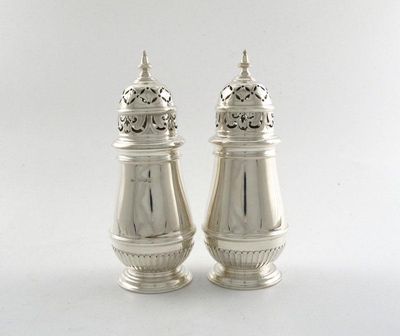 Appraisal: A pair of silver sugar casters tapering circular form part