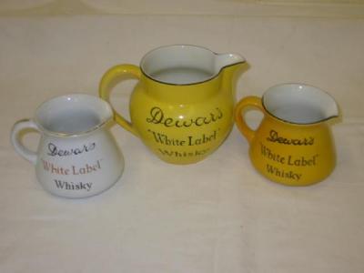 Appraisal: Three Dewars White Label jugs including Mintons and John Maddock