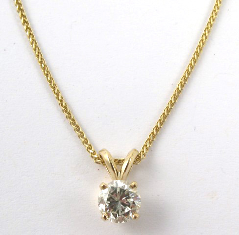 Appraisal: DIAMOND AND FOURTEEN KARAT GOLD NECKLACE The pendant is set