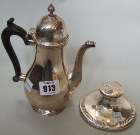 Appraisal: A silver baluster shaped small coffee pot on a circular