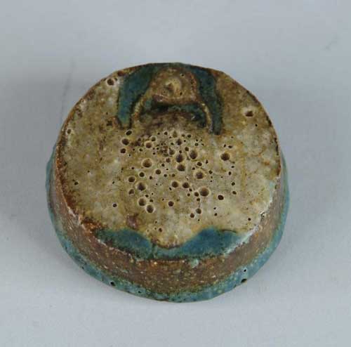 Appraisal: GRUEBY POTTERY PAPERWEIGHT Disc shape having bat or beetle top