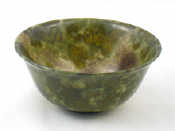 Appraisal: A Chinese turned dark green jade bowl cm dia