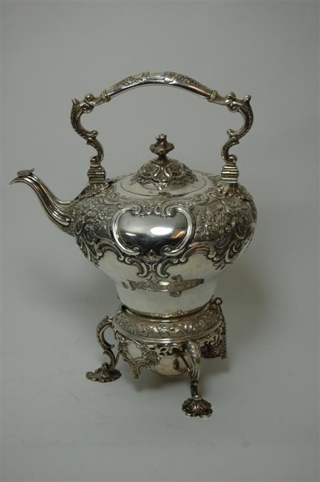 Appraisal: A matched Victorian spirit kettle stand and burner the kettle