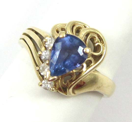 Appraisal: TANZANITE DIAMOND AND FOURTEEN KARAT GOLD RING set with four