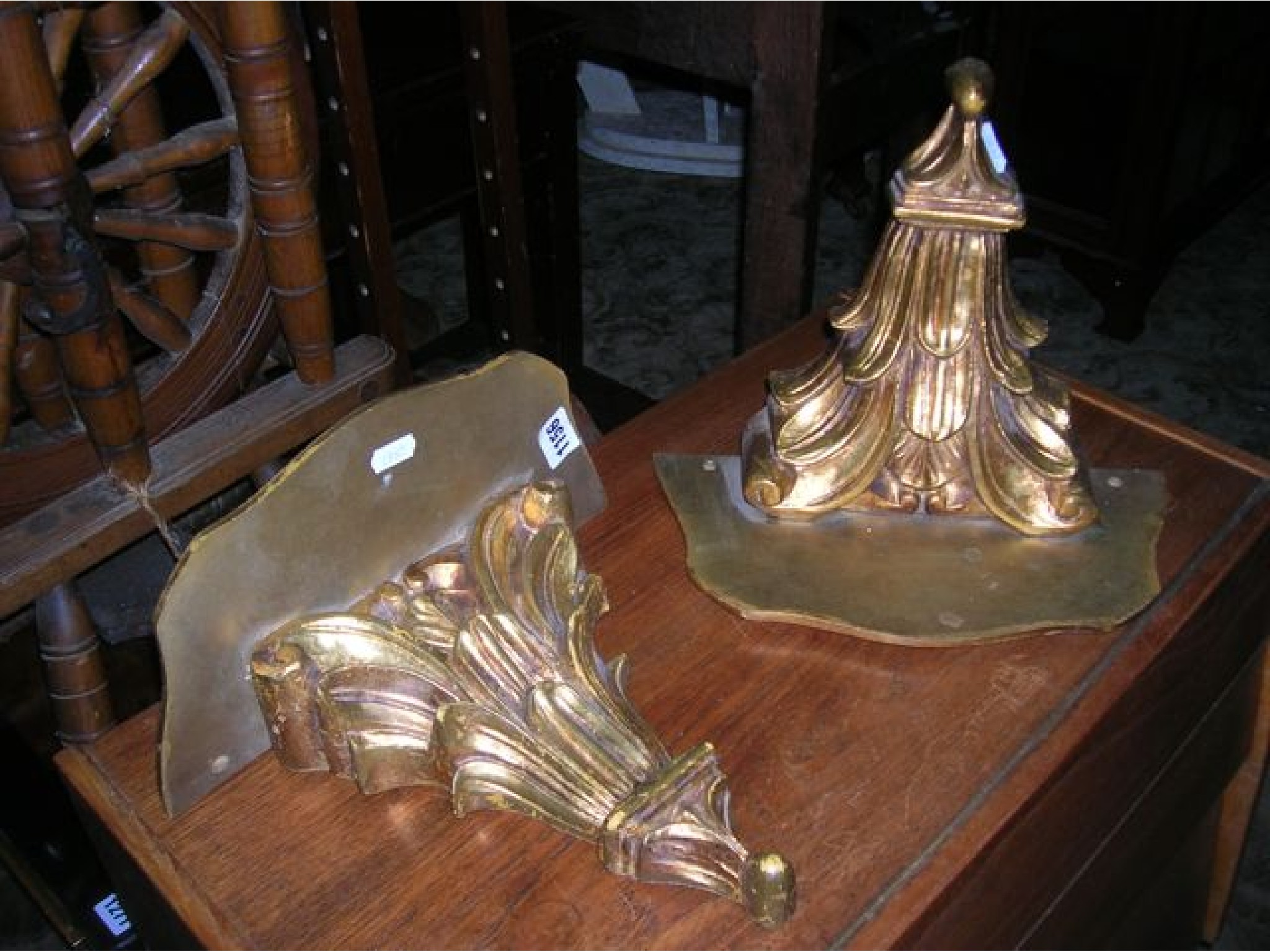 Appraisal: A pair of decorative gilt wall brackets with scrolling acanthus