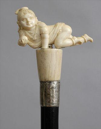 Appraisal: CARVED IVORY HANDLED EBONIZED CANE An Indian carving of a