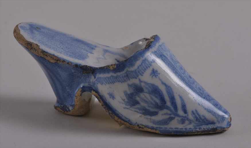 Appraisal: MINIATURE DUTCH DELFT BLUE AND WHITE SHOE Painted with tulips