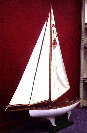 Appraisal: A gaff rig wooden pond yacht with cotton main and