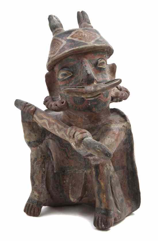 Appraisal: A Nayarit Terracotta Figure depicting a seated male warrior with