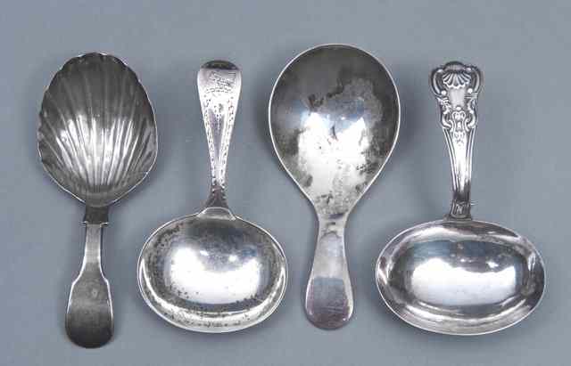 Appraisal: A GEORGIAN SILVER CADDY SPOON with plain oval bowl and