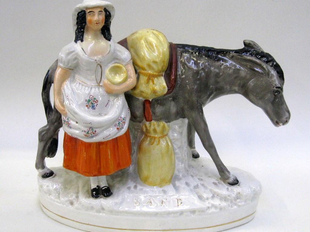 Appraisal: Staffordshire figure group of a maid with donkey entitled 'Sand'