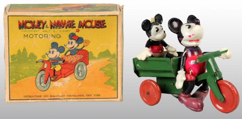 Appraisal: Mickey Minnie Mouse Motoring Toy in Orig Box Description Celluloid