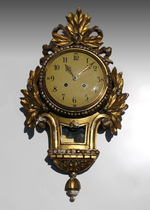 Appraisal: GILT WOOD CARTEL CLOCK Gilt wood with ribbon leaf and