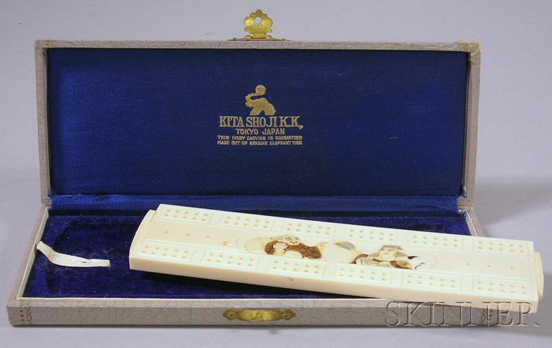 Appraisal: Japanese Carved Ivory Cribbage Board side doors contain game pieces