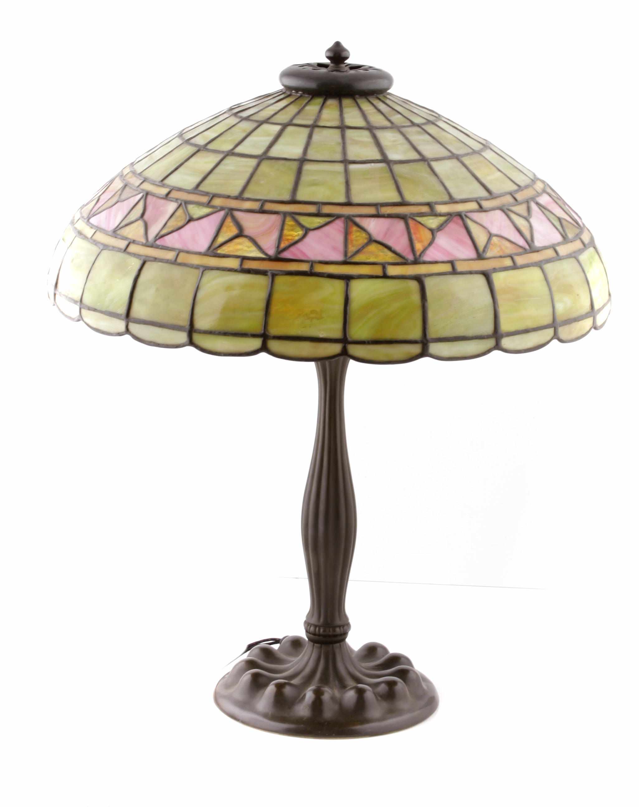 Appraisal: An American leaded glass and Duffner Kimberly patinated metal lamp