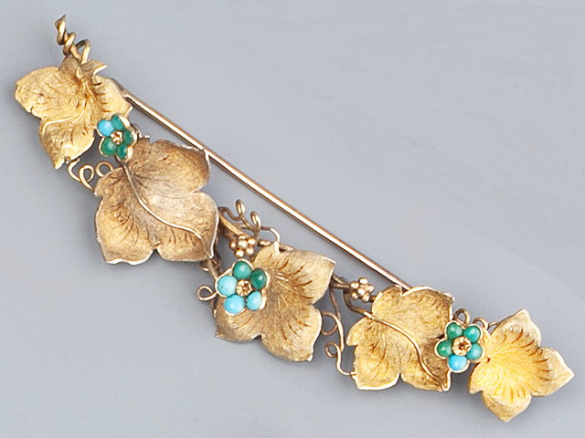 Appraisal: A TURQUOISE SET BROOCH in the form of vine leaves