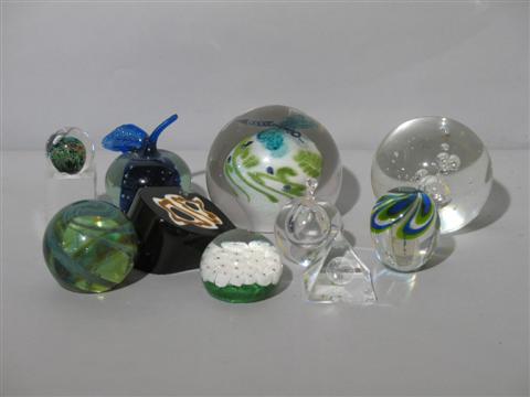 Appraisal: COLLECTION OF GLASS PAPERWEIGHTS Comprising a modern white carpet ground