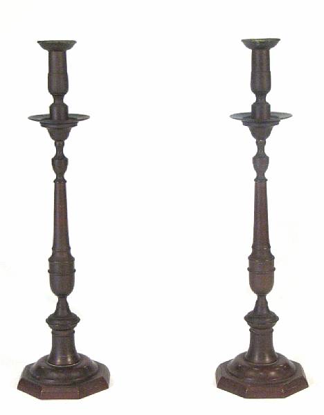 Appraisal: A pair of patinated metal candlesticks height in