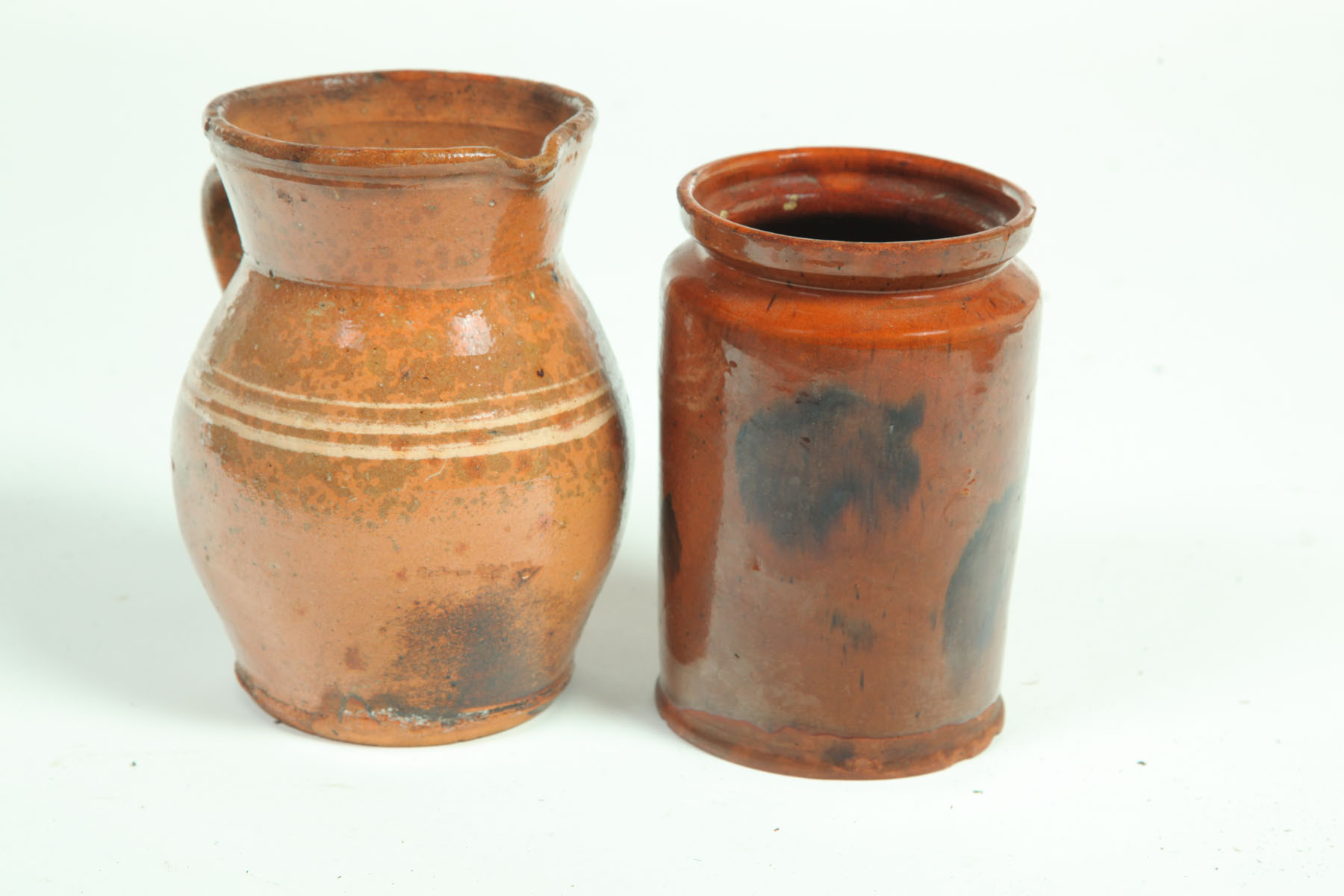 Appraisal: TWO PIECES OF REDWARE American mid th century Canning jar