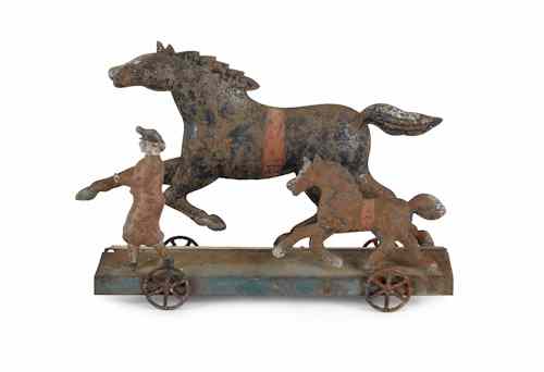 Appraisal: Painted tin horse pull toy th c h w