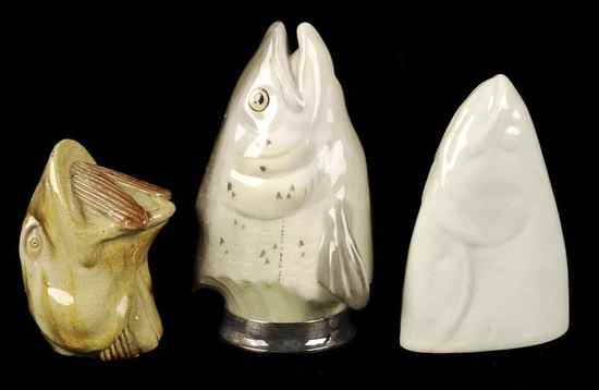 Appraisal: Three various fish-head stirrup cups including a white porcelain example