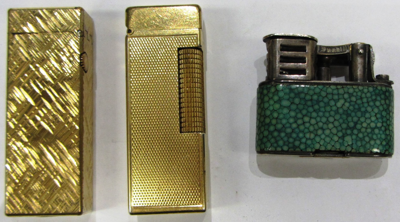 Appraisal: Two gilt metal Dunhill rectangular gas lighters and a Dunhill