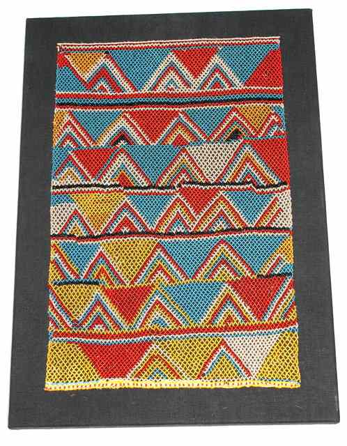 Appraisal: A WEST AFRICAN BEADWORK PANEL decorated a tri-colour zigzag design