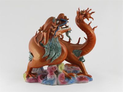 Appraisal: A Chinese famille rose model of a writhing coral-coloured dragon