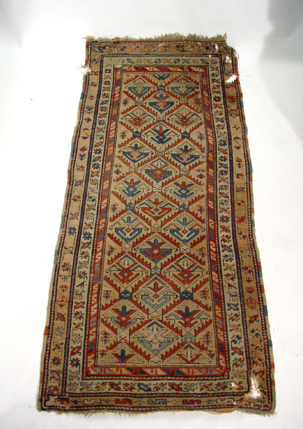 Appraisal: Old carpet runner with colourful geometric patterning cm x cm