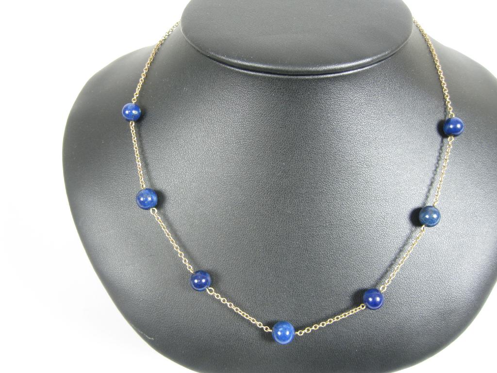 Appraisal: A Lapis Lazuli Bead Necklace the seven beads at intervals