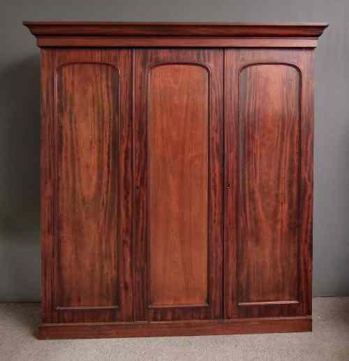 Appraisal: A Victorian mahogany three door fitted wardrobe with moulded cornice