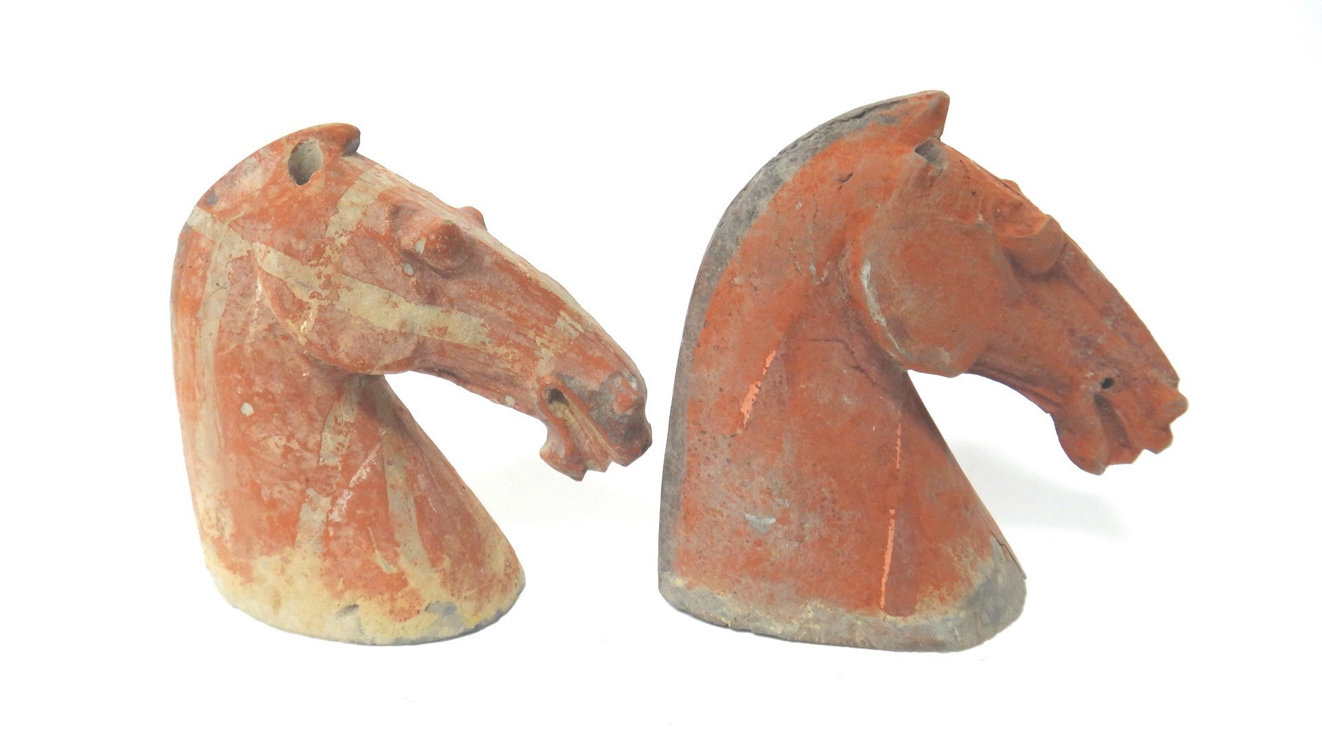 Appraisal: Two Chinese painted grey pottery horse heads Han Dynasty each