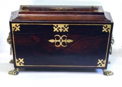 Appraisal: A REGENCY ROSEWOOD AND BRASS INLAID TEA CADDY of sarcophagus