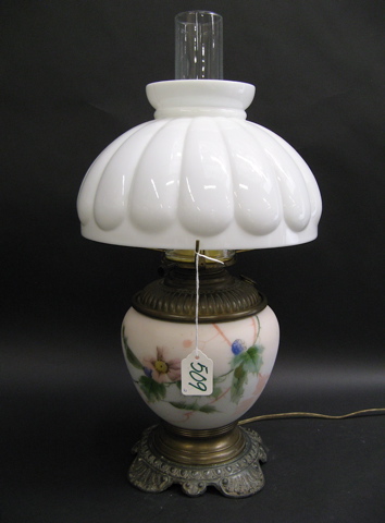 Appraisal: TWO ELECTRIFIED OIL LAMPS One has a decorative floral porcelain