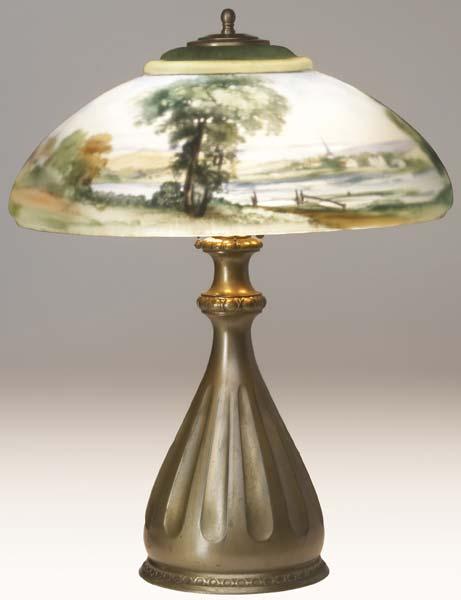 Appraisal: PAIRPOINT Table lamp its Landsdowne shade reverse-painted with a farm