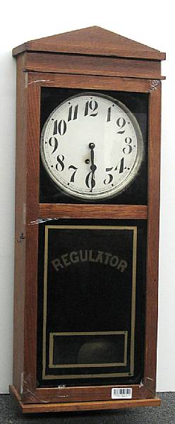 Appraisal: An American oak and eglomis wall clock E Ingraham amp