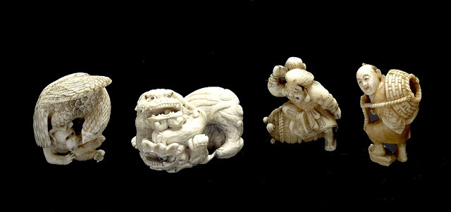 Appraisal: A Japanese ivory netsuke of Daikokulate th Centuryholding his mallet