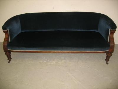 Appraisal: A VICTORIAN WALNUT FRAMED CLUB SOFA of Chesterfield type upholstered