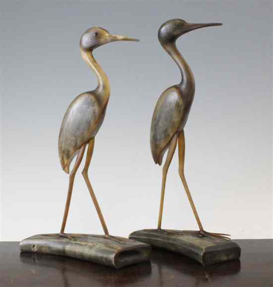 Appraisal: A pair of Chinese carved horn models of cranes on