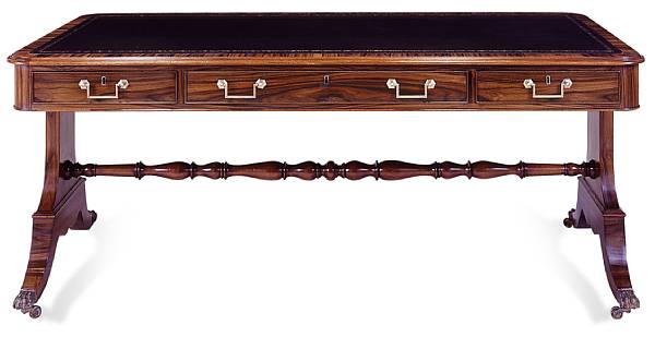 Appraisal: A Regency style rosewood partners' writing table On shaped supports