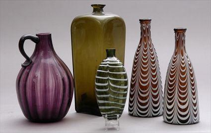 Appraisal: FIVE GLASS TABLE ARTICLES Comprising a pair of brown bottles