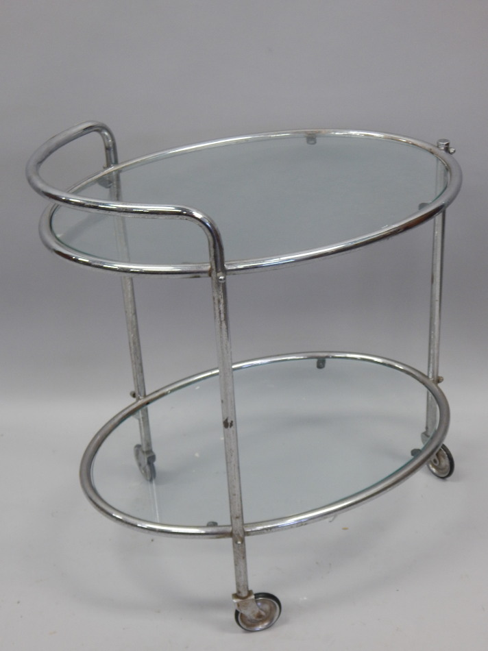 Appraisal: An Art Deco style chrome plated oval two tier trolley