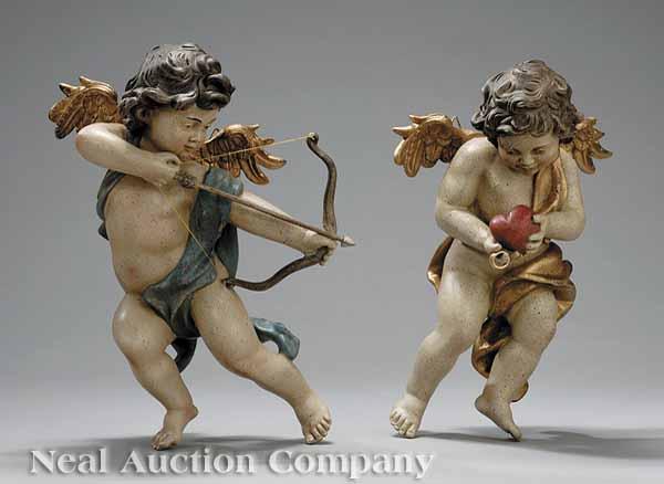 Appraisal: A Pair of Continental Polychromed Cherub Figures in animated poses