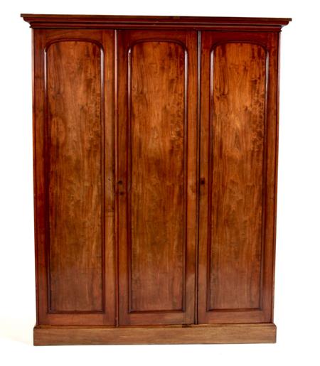 Appraisal: A Victorian mahogany three door wardrobe the projected moulded cornice