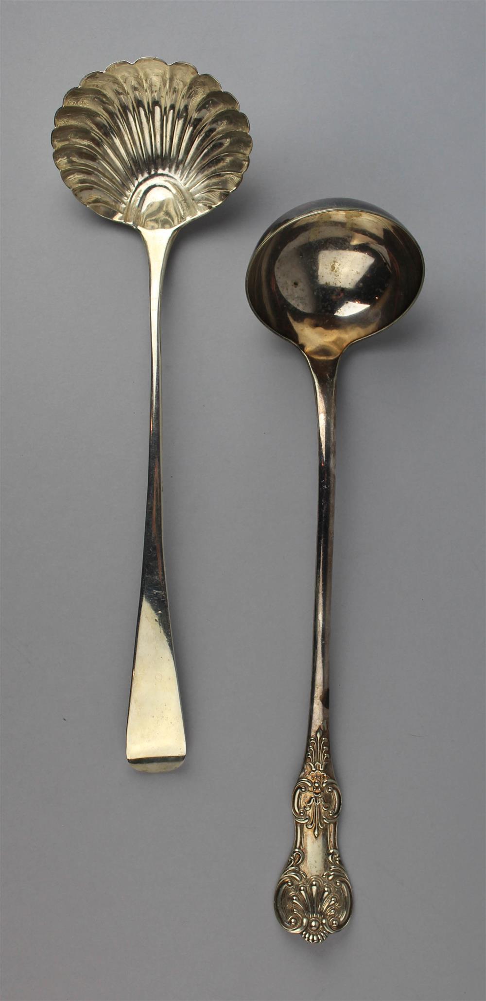 Appraisal: AN ENGLISH SILVER PUNCH LADLE AND ONE PLATED EXAMPLE the