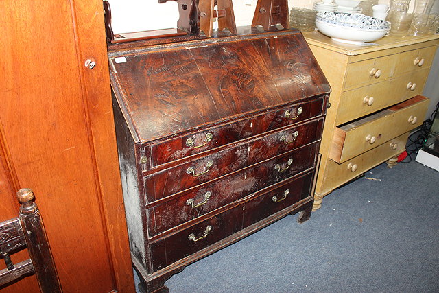 Appraisal: A GEORGIAN MAHOGANY BUREAU the fall front opening to reveal