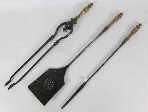 Appraisal: A set of three Georgian steel and cast brass fire