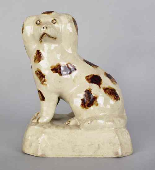 Appraisal: Salt glazed seated stoneware spaniel th c h