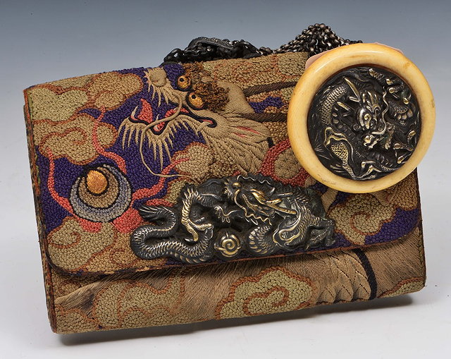 Appraisal: A Japanese embroidered tabako-ireMeiji periodwith ten silver chain and ojime